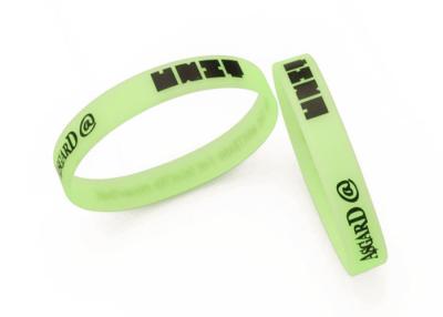 China Buy custom glow in the dark silicone wristband with green/blue/red light for sale