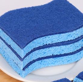 Sponge in use cleaning a plate
