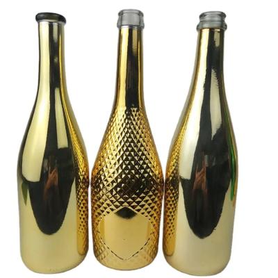 China Custom Glass Bottle Round 750ml Empty Gold Plated Champagne Bottle for sale