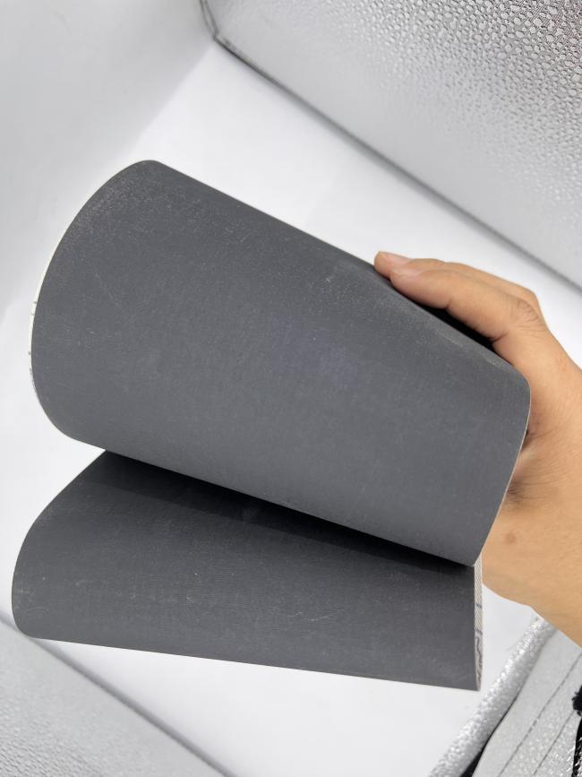 Silicon carbide sanding belt in use for metal polishing