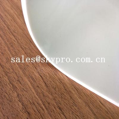 China Rollo blanco a prueba de calor de la estera de la goma de silicona de la goma de silicona del rollo transparente de la hoja en venta