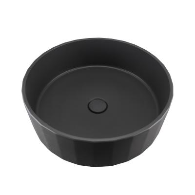 China Black Round Concrete Wash Basin With No Faucet Holes And Pop Up Drain en venta