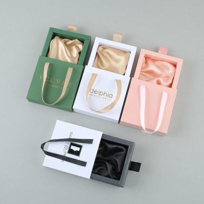 Китай Пинк коробок ювелирных изделий ящика скольжения упаковывая изготовленный на заказ печатая продается