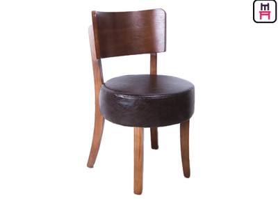 中国 円形の革によってパッドを入れられるアームレス食事の椅子、暗い木製の食堂の椅子  販売のため