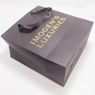 China Custom Printed Kraft Paper Bags Silk Handle Recyclable For Gift Packaging for sale