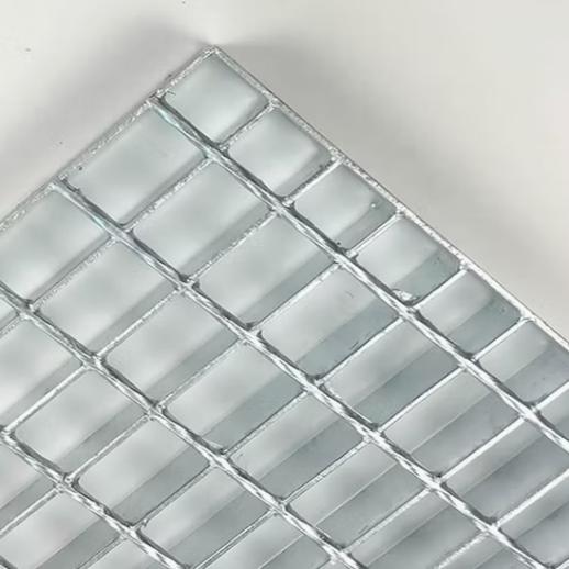 Steel grating used as stair treads with serrated surface for slip resistance