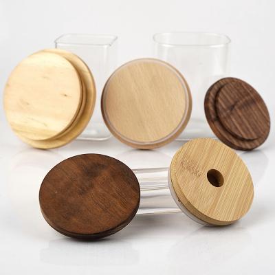 China Candle Clear Glass Jars With Wooden Lids Screw Top for sale