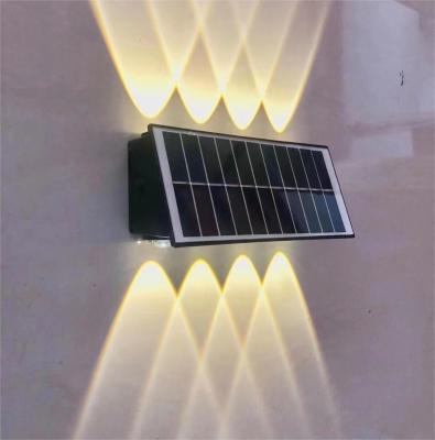 China 100lm UP Down Solar Outside Wall Lights Wall Mounting Colorful With Lithium Battery for sale