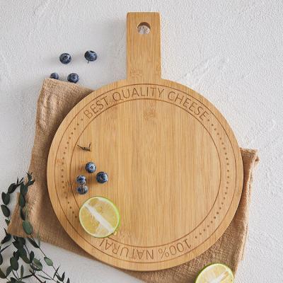 China Organic Round Bamboo Cutting Board With Hole And Handle for sale