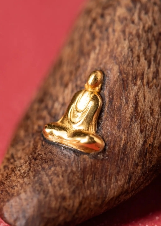 Carved Agarwood Buddha Necklace Pendant side view highlighting elegant design