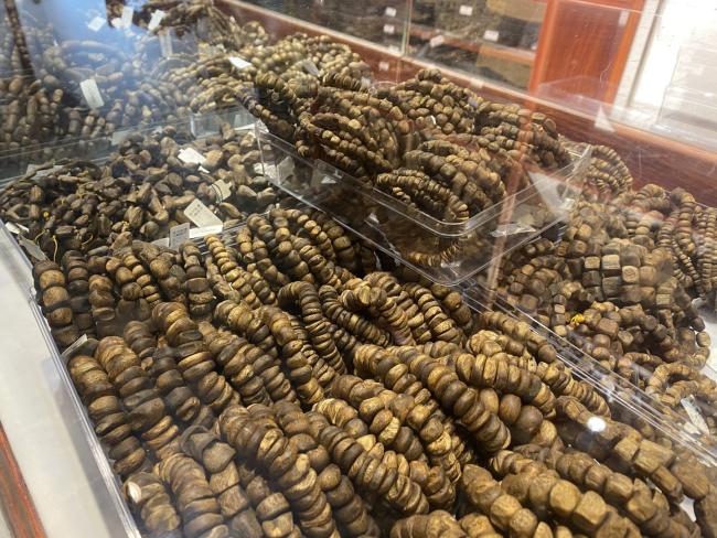 Agarwood production department craftsmanship process showing artisan at work