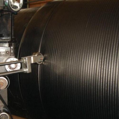 Close-up view of grooved press roll surface texture
