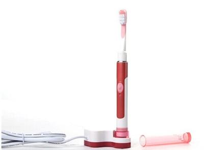 China Sonic carregável que vibra a escova de dentes elétrica do curso cor-de-rosa com tampão à venda