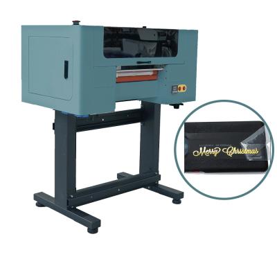 China CMYK W V DTF Impressora a jato de tinta Etiqueta autocolante máquina de impressão Uv com cabeça F1080 XP600 à venda