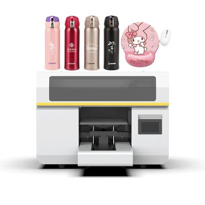 China Impresora de rollo UV de plataforma de 300x475mm con I3200 Impresora de cabeza de impresión para camisetas botellas de teléfono en venta