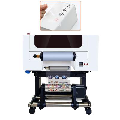 Китай 6 цветной УФ DTF печать и ламинирование принтер интегрированная машина с головой F1080 продается