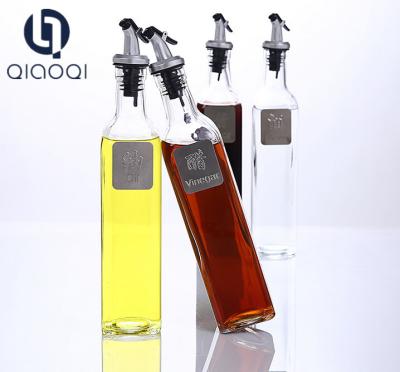 China Glass oil dispenser with stainless stopper at bottom price for sale