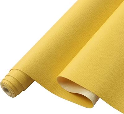 China tela amarilla de la imitación de cuero del PVC del cuero artificial del PVC de 0.5m m para el material del bolso en venta