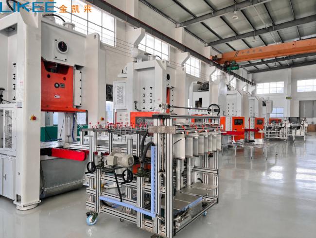 Foil container production line with decoiler and press in operation