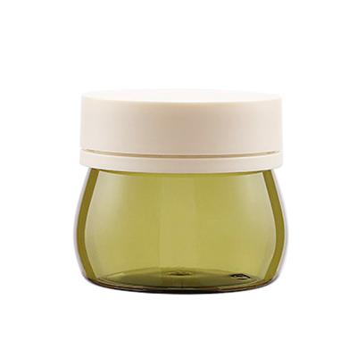 China 30g 50g 80g 100g Cosmetic Clear Green Glass Jar With Plastic Lid For Body Cream for sale