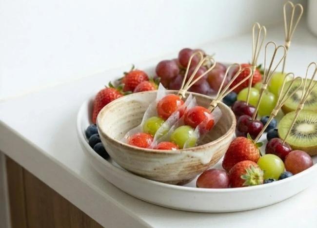 red and black bamboo cocktail picks for color-coded food presentation.