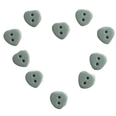 China Plastic Resin Chalk Buttons With Heart Shape 2 Hole Cyan Color Use On Shirt Diy Material for sale