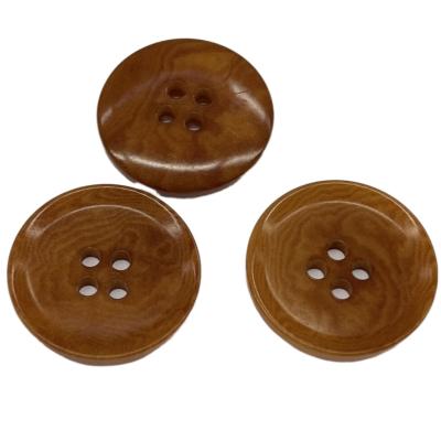 China Dye Brown Color 36L Natural Corozo Buttons With Rim Environment Friendly for sale
