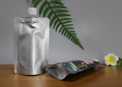 中国 注文の液体ジュースのための口が付いているハンドルによって薄板にされるDoypackのパッキング袋 販売のため