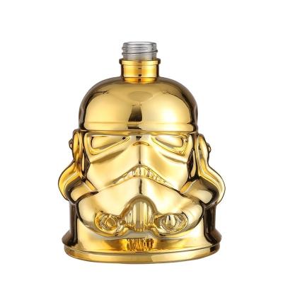 China Top Collar Material Glass Gold Plated Human Face Shape Bottle for Brandy Tequila Rum for sale