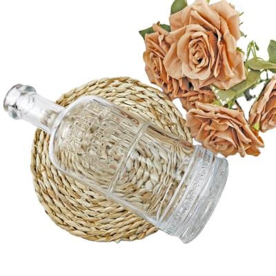 China Custom Glass Bottle for Vodka Spirits High Polymer Plug Transparent Cylindrical Shape for sale
