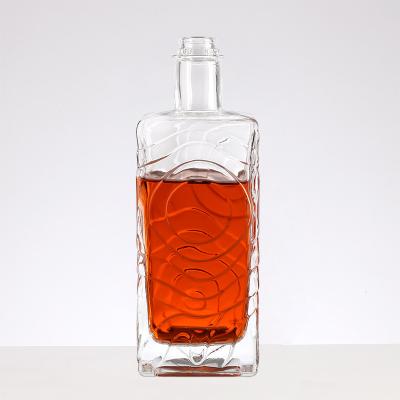 China Embossed Square Wine Glass Bottle With Glass Lid Wine Hot stamping Water wave pattern for sale