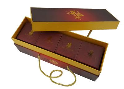 中国 Gold CMYK Full Colors Rigid Cardboard Material Lid Box Bottom Packing Box with Thick PP Handle Rope 販売のため