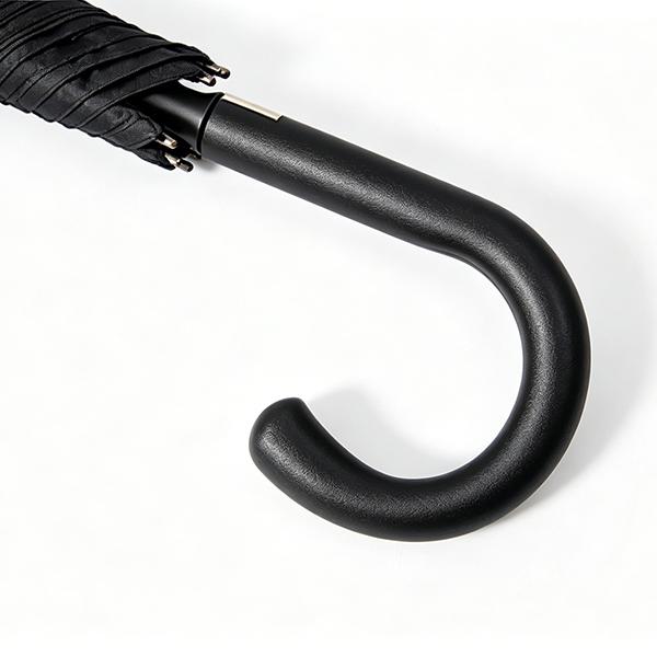 Close-up of hidden auto open button on curved cane handle of 46 inch fiberglass walking stick umbrella