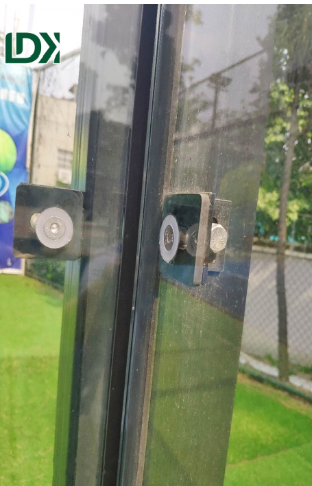 Padel court glass panel installation