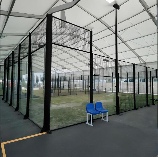Padel court in use during professional tournament