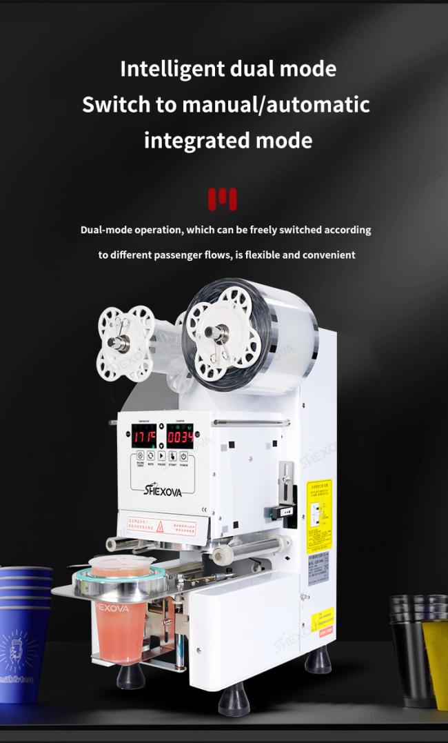 Sealing machine in operation with beverage cups