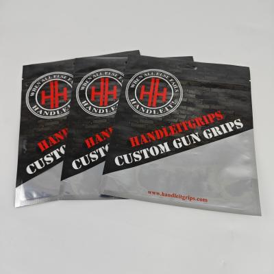 中国 High Quality Custom Printed Glossy Surface Fishing Bait Packaging Plastic Bag  3 Side Seal Bags With Euro Hole 販売のため