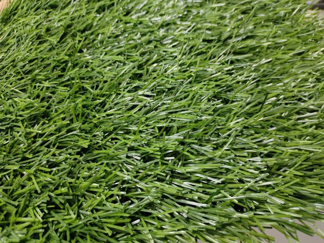 Close-up view of 40mm artificial grass texture and backing structure