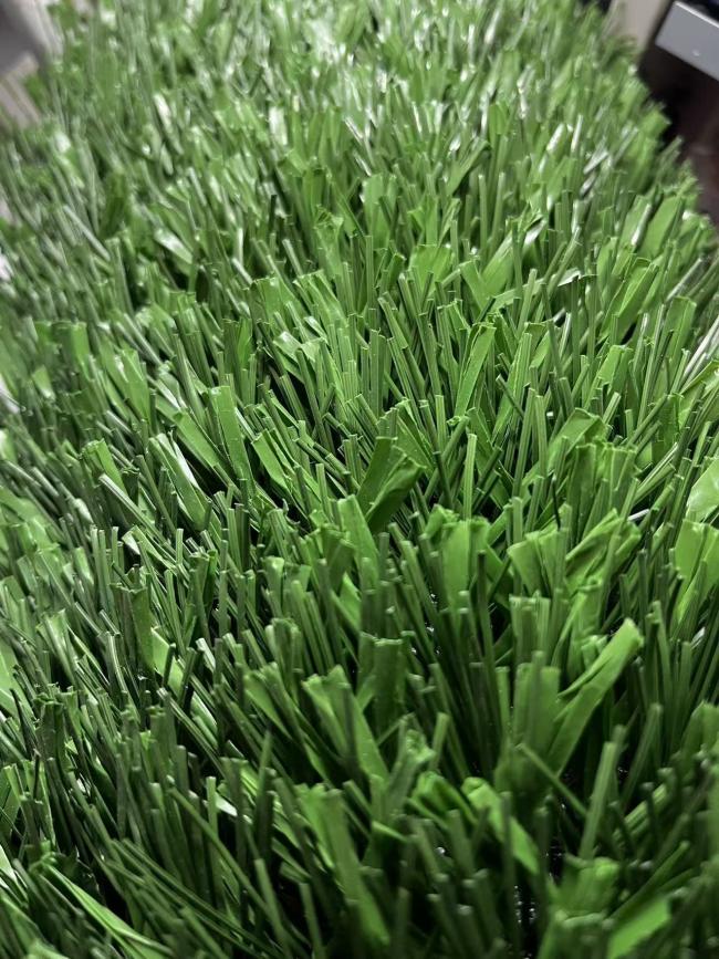 Football field installation showing complete artificial turf surface