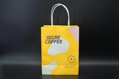 China OEM / ODM Printed Paper Carrier Bags Custom Paper Bags For Business Use for sale