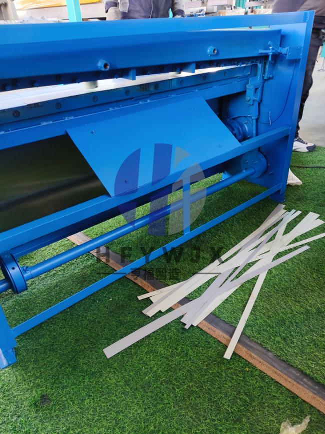 Close-up view of electric shearing machine blade and tool holders