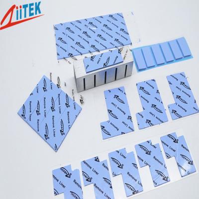 China reemisor de isofrecuencia termal naturalmente pegajoso TIF100-40-05E del azul 4,0 W/mK con la hoja adhesiva -50 de la goma de silicona de la capa a 200℃, en venta