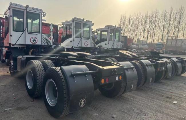 China Yard Jockey/ Yard Spotter/ Hostler/Mule/Terminal Truck for Towing/Hauling Terminal Semi Trailer