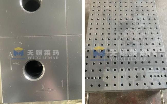 Close-up of welding table surface and hole pattern
