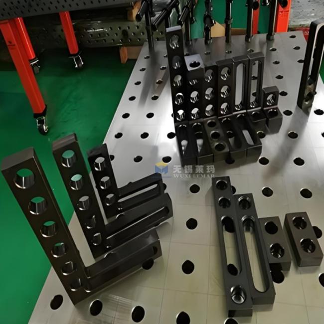 Positioning rulers in use on welding table