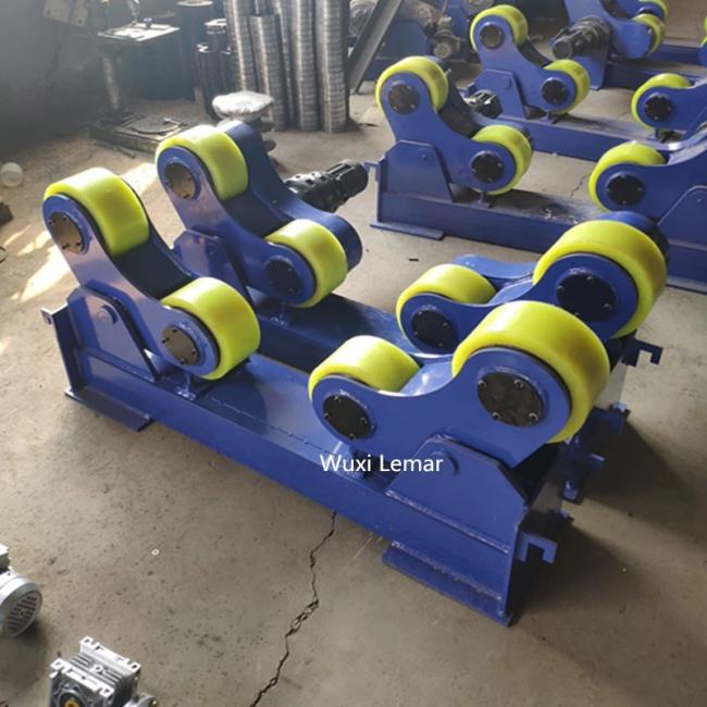 Tank turning rolls supporting large cylindrical vessel