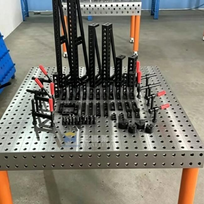 D16 welding table in use with various clamping accessories