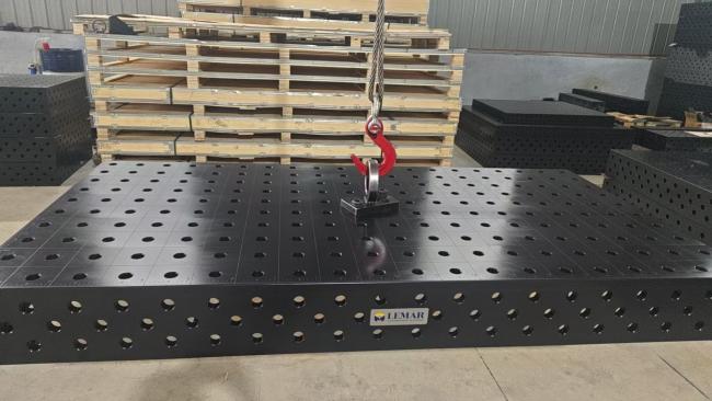 Welding table under heavy load showing stability and structural integrity