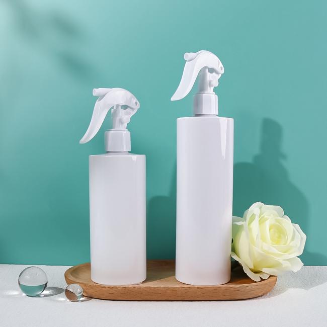 White plastic spray bottle with black nozzle showing dual spray modes