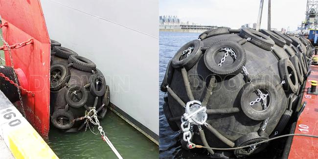 Pneumatic rubber fender floating between ships